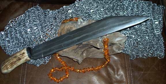 Straight laminate seax, a reproduction of a weapon from 300-900 CE